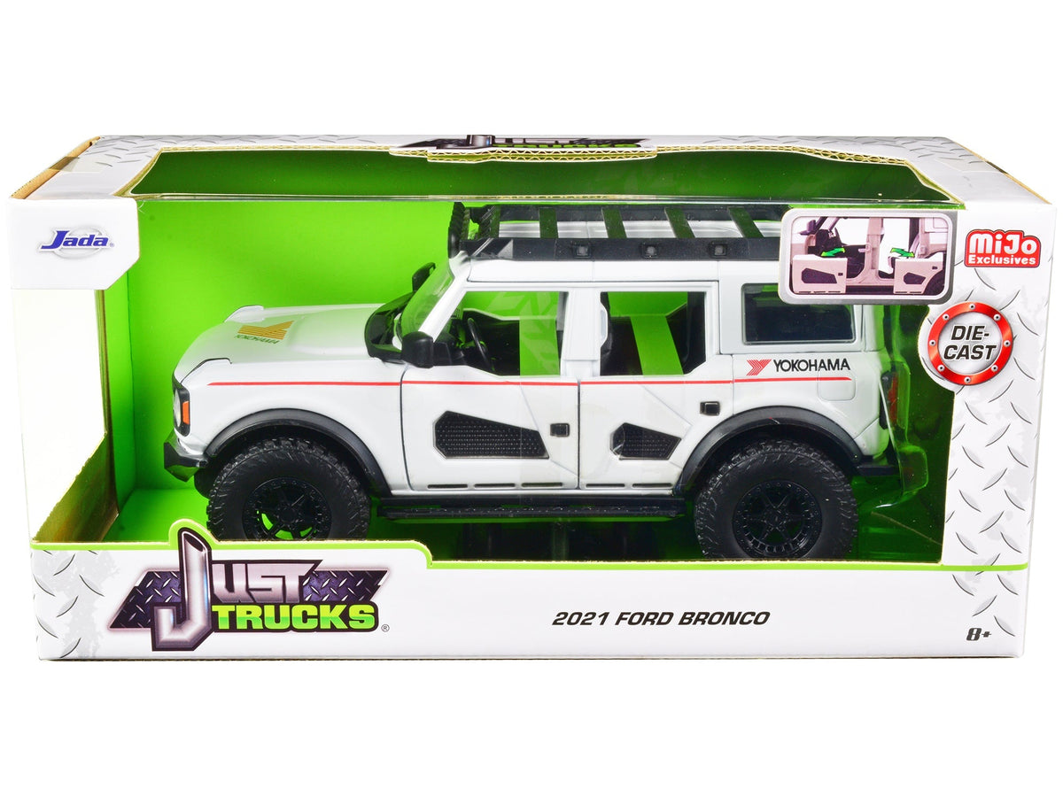 2021 Ford Bronco White with Red Stripes and Roof Rack "Yokohama Tires" "Just Trucks" Series 1/24 Diecast Model Car by Jada  free shipping USA